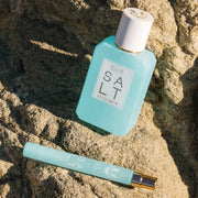 IMAGE 3: SALT 50ml & travel spray on rocks