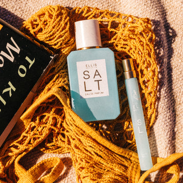IMAGE 7: SALT 50ML BOTTLE AND TRAVEL SPRAY at beach near book