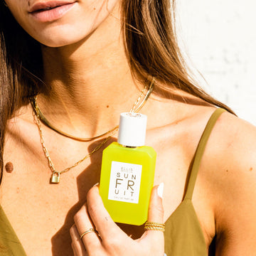 Model holding SUN FRUIT 