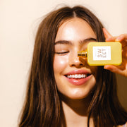 IMAGE 4: MODEL HOLDING SWEET 50ML BOTTLE