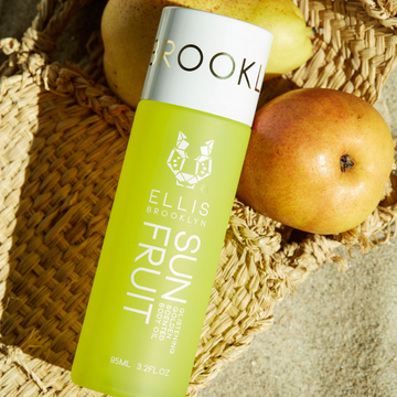 IMAGE 2: SUN FRUIT BODY OIL ON BEACH WITH FRUIT