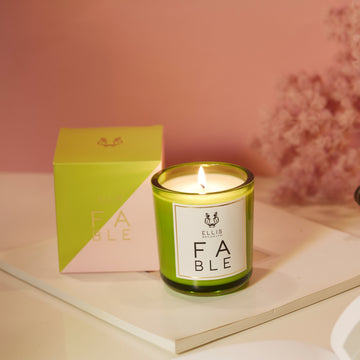 IMAGE 4: FABLE candle AND BOX NEAR FLOWERS