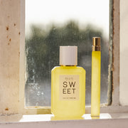 SWEET 50ml bottle & travel spray in window 